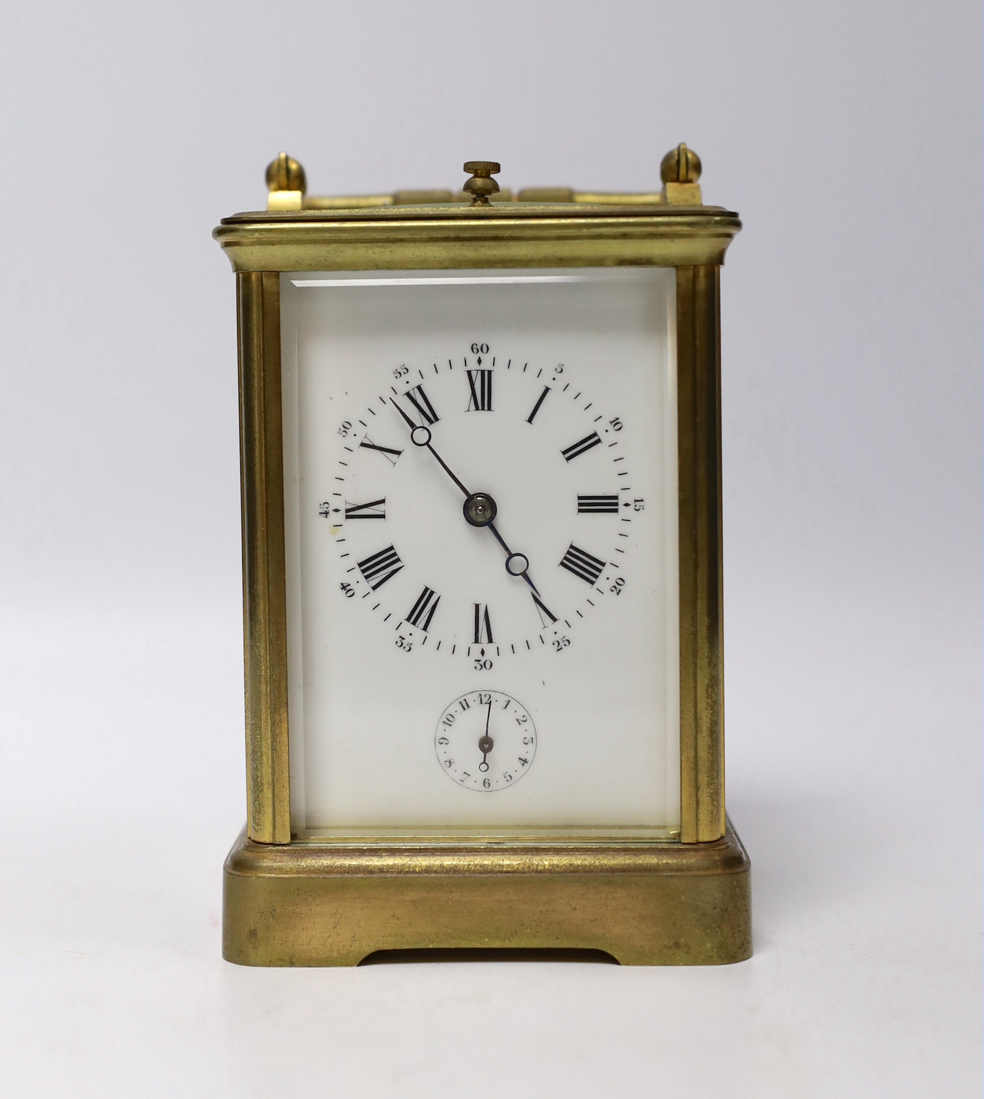 A late 19th century French brass repeating carriage clock, with alarm, 14.5cm high (handle down)